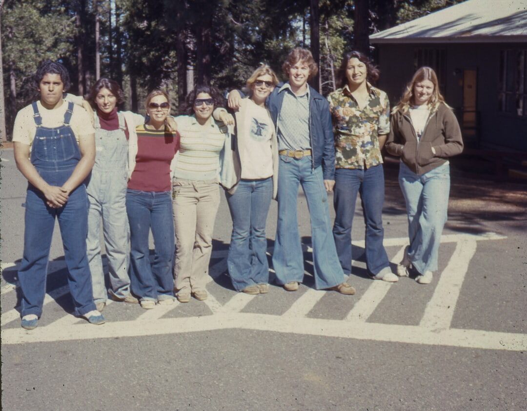 Group photo of senior club members and volunteers in a community center