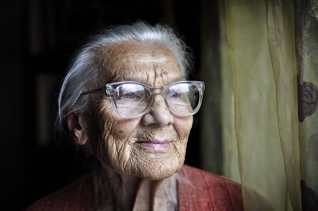 Portrait of a cheerful senior woman with glasses