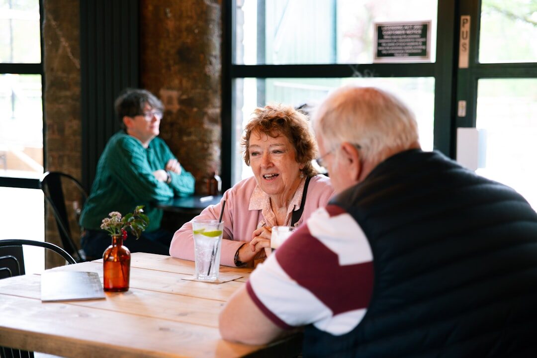 seniors laughing at table