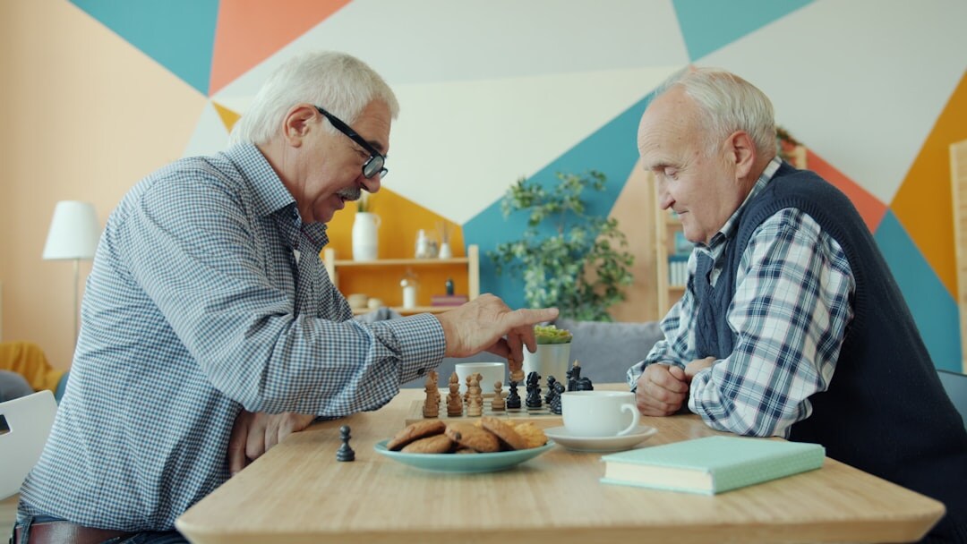 elderly men playing chess